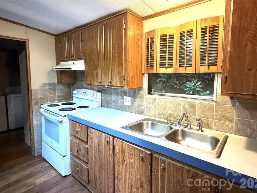 261 Warren Creek Road, Candler, NC 28715.  MLS# CAR4413970, YatesRealty ID 44536. 