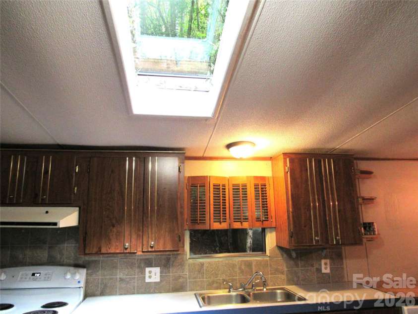 261 Warren Creek Road, Candler, NC 28715.  MLS# CAR4413970, YatesRealty ID 44536. 
