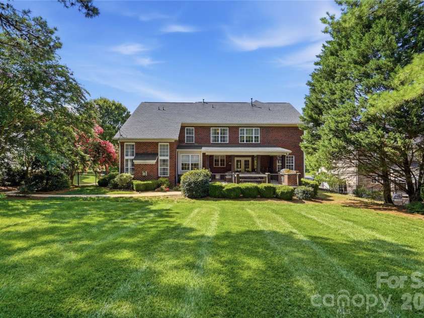 8403 Dunton Court, Waxhaw, NC 28173.  MLS# CAR4400840, YatesRealty ID 44556. Backyard from pool