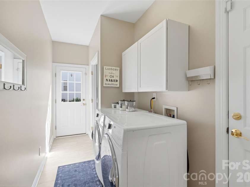 8403 Dunton Court, Waxhaw, NC 28173.  MLS# CAR4400840, YatesRealty ID 44556. Main Floor Laundry Room