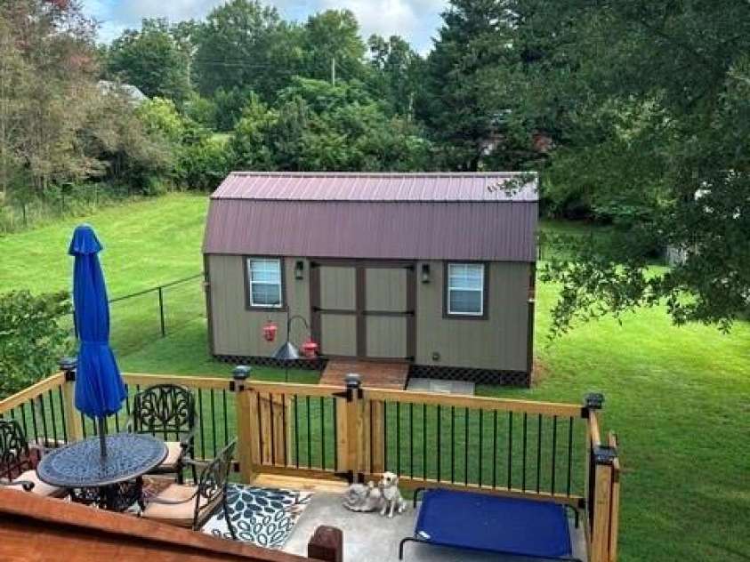 393 Arlington Street, Forest City, NC 28043.  MLS# CAR4414154, YatesRealty ID 44557. New patio and the 10X20 mancave/possible workshop.