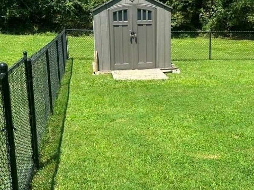 393 Arlington Street, Forest City, NC 28043.  MLS# CAR4414154, YatesRealty ID 44557. Storage for riding mower that stays