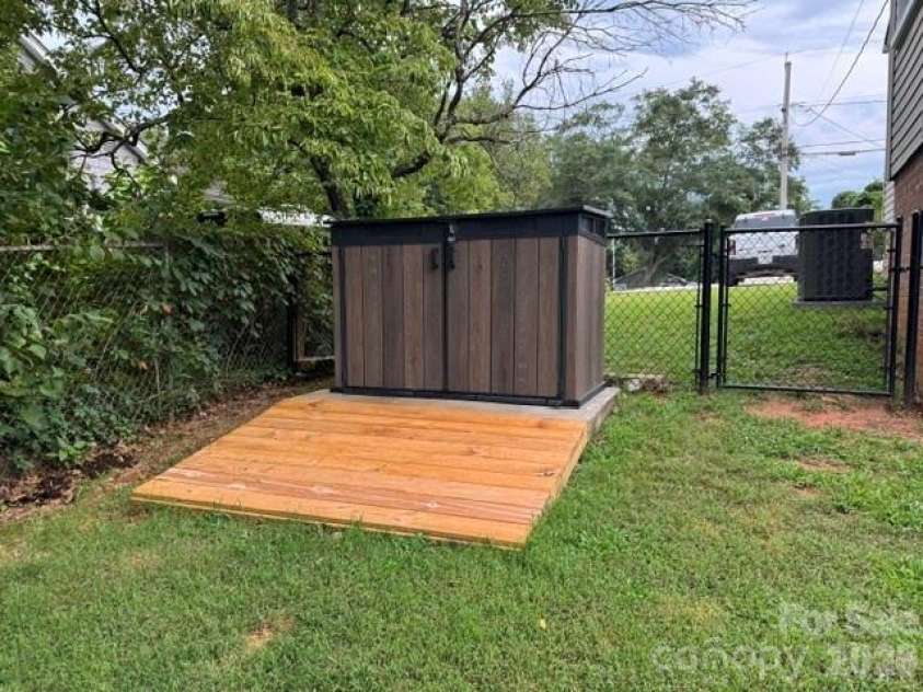 393 Arlington Street, Forest City, NC 28043.  MLS# CAR4414154, YatesRealty ID 44557. Trash can storage