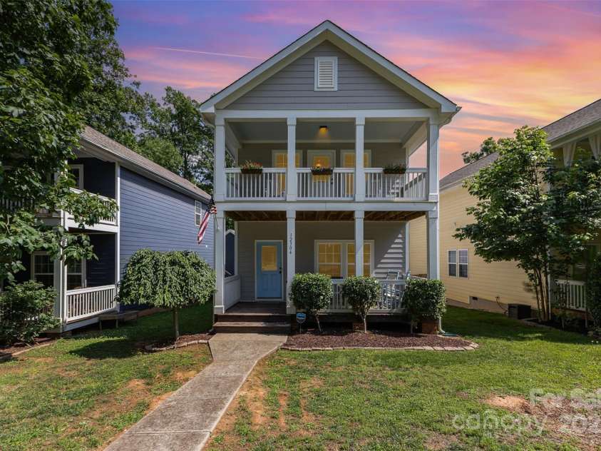 12304 Huntersville Concord Road, Huntersville, NC 28078.  MLS# CAR4268333, YatesRealty ID 4456. Charming Charleston-style exterior with beautiful double covered porches and welcoming blue door