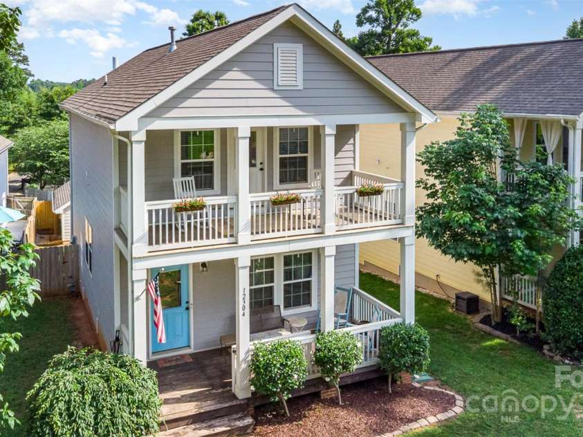 12304 Huntersville Concord Road, Huntersville, NC 28078.  MLS# CAR4268333, YatesRealty ID 4456. Double covered porches - enjoy from the living area and from the primary bedroom