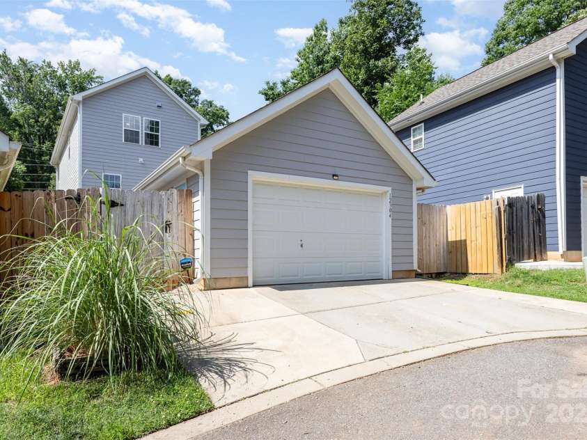 12304 Huntersville Concord Road, Huntersville, NC 28078.  MLS# CAR4268333, YatesRealty ID 4456. Oversized 1-car garage with parking for 2 on driveway