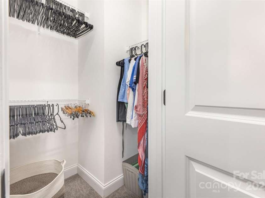 12304 Huntersville Concord Road, Huntersville, NC 28078.  MLS# CAR4268333, YatesRealty ID 4456. Primary bedroom's walk-in closet (there is another traditional closet as well)