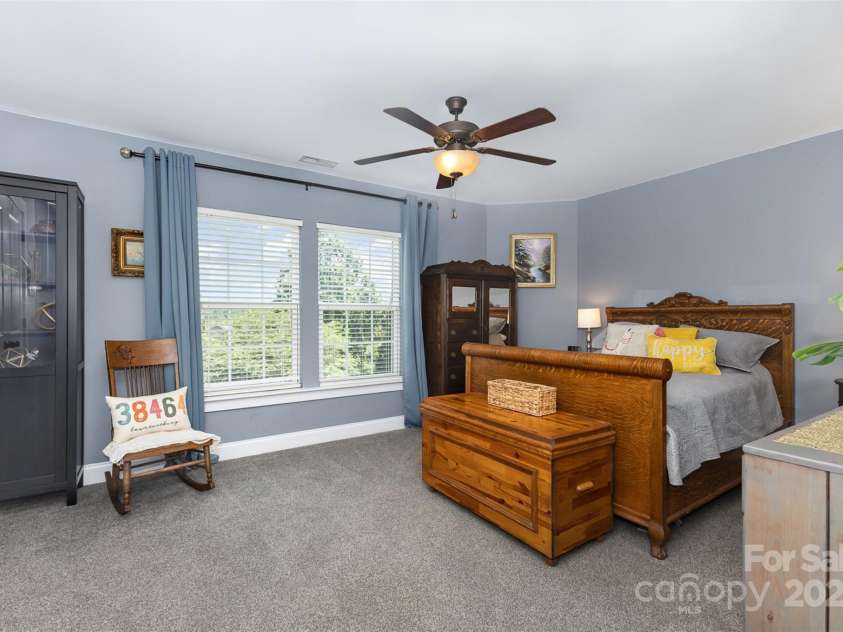 12304 Huntersville Concord Road, Huntersville, NC 28078.  MLS# CAR4268333, YatesRealty ID 4456. Upper level guest bedroom with double door closet and large windows
