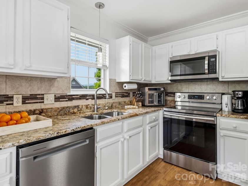 4402 Marble Way, Asheville, NC 28806.  MLS# CAR4413384, YatesRealty ID 44561. Pendant Light & Disposal