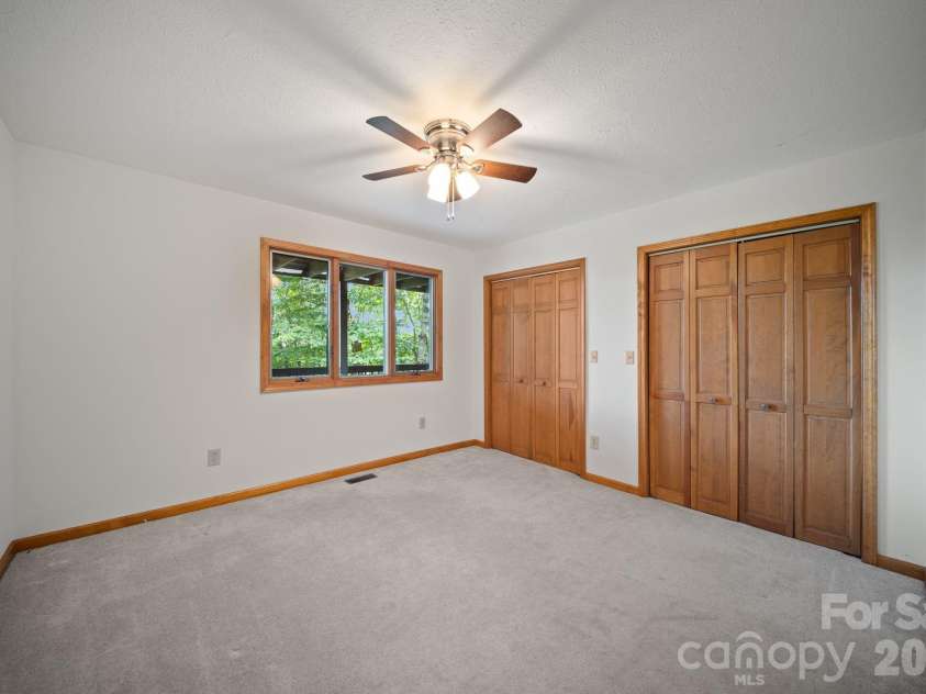 1105 High Vista Drive, Mills River, NC 28759.  MLS# CAR4414362, YatesRealty ID 44568. Unstaged bedroom/flex  in basement 2