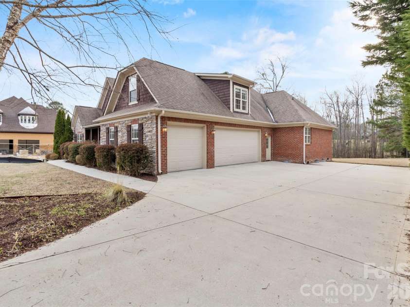 5164 Mill Race Lane, Lancaster, SC 29720.  MLS# CAR4342322, YatesRealty ID 4458. 3-car Side Entry Garage