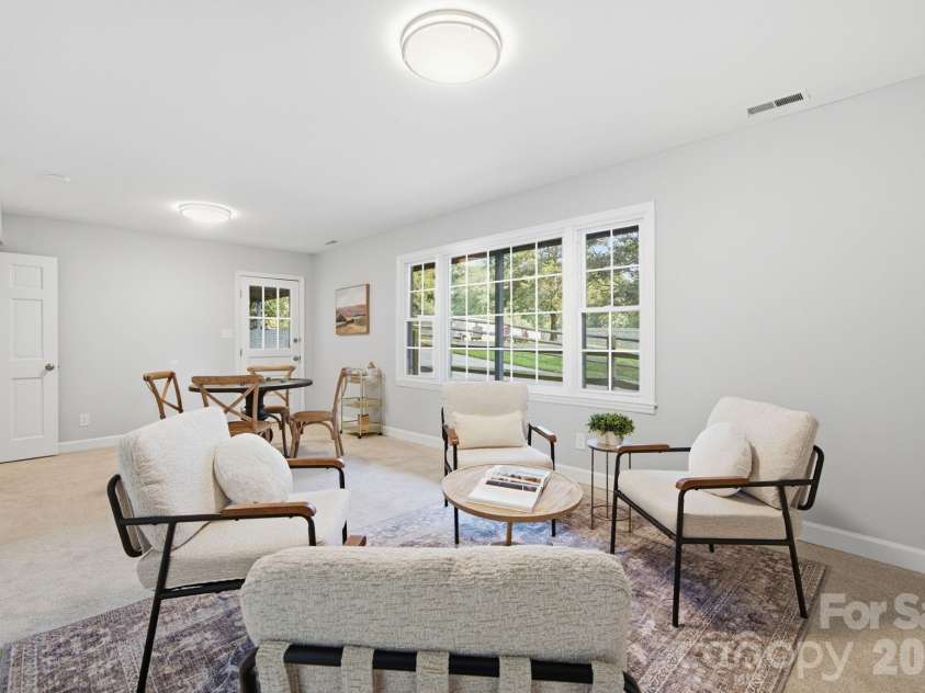 8323 Cliffside Drive, Charlotte, NC 28270.  MLS# CAR4413932, YatesRealty ID 44601. Down stairs family room