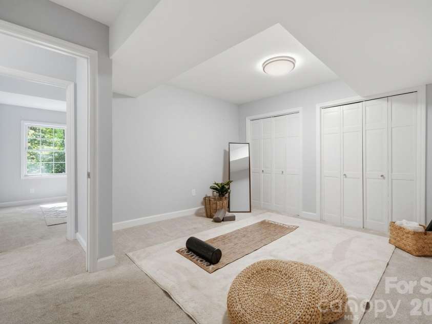 8323 Cliffside Drive, Charlotte, NC 28270.  MLS# CAR4413932, YatesRealty ID 44601. Downstairs extra room staged as exercise room