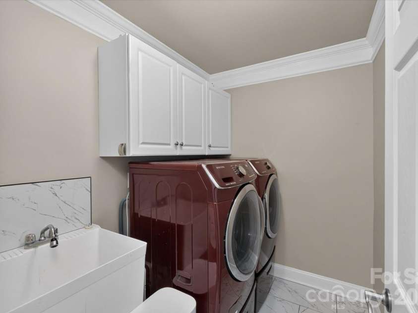 8306 Denholme Drive, Waxhaw, NC 28173.  MLS# CAR4413160, YatesRealty ID 44605. Laundry room with sink