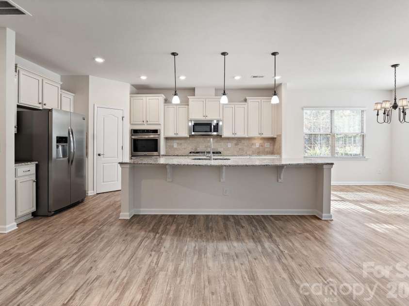 6948 Sunset Crater Place, Lancaster, SC 29720.  MLS# CAR4413356, YatesRealty ID 44612. Kitchen with island and eat-in dining area