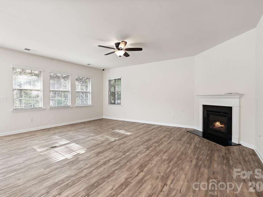 6948 Sunset Crater Place, Lancaster, SC 29720.  MLS# CAR4413356, YatesRealty ID 44612. Living room with fireplace
