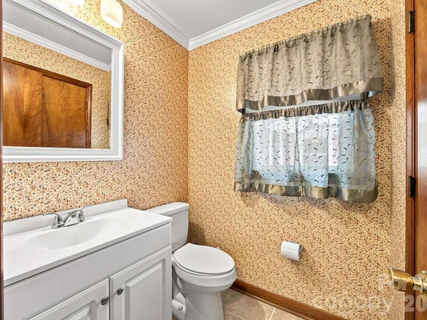 1285 Patterson Street, China Grove, NC 28023.  MLS# CAR4410230, YatesRealty ID 44618. Half bath off kitchen hall