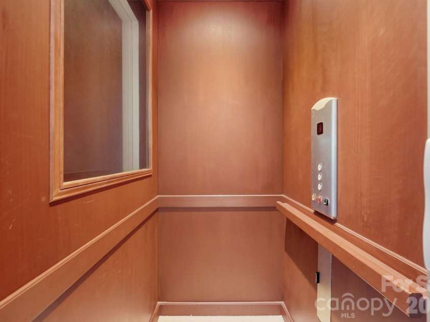 20124 Bascom Ridge Drive, Cornelius, NC 28031.  MLS# CAR4408389, YatesRealty ID 44623. A private residential elevator provides convenient access between levels, adding an important element of comfort and accessibility to this substantial waterfront home.