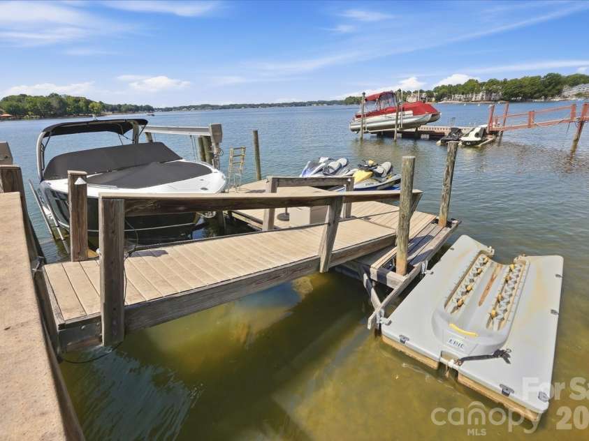 20124 Bascom Ridge Drive, Cornelius, NC 28031.  MLS# CAR4408389, YatesRealty ID 44623. The dock is equipped for an active waterfront lifestyle, with dedicated space for a boat and personal watercraft. Easy access to open water makes it simple to launch a day of cruising, watersports, or relaxing on 