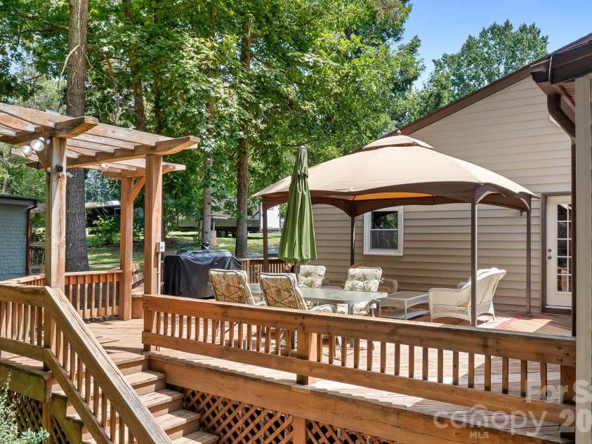 7224 Right Angle Street, Sherrills Ford, NC 28673.  MLS# CAR4411312, YatesRealty ID 44630. Walk down from the back deck to your dock