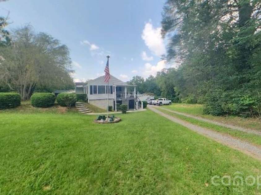 214 Governors View Road, Asheville, NC 28805.  MLS# CAR4413776, YatesRealty ID 44636. Side Yard