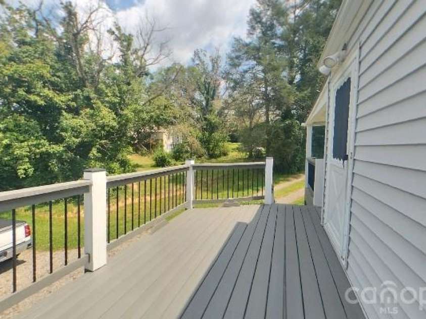 214 Governors View Road, Asheville, NC 28805.  MLS# CAR4413776, YatesRealty ID 44636. Uncovered Back Deck