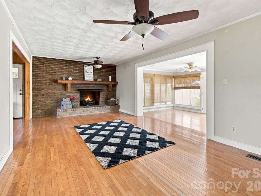 19 Pj Mcree Road, Maiden, NC 28650.  MLS# CAR4414681, YatesRealty ID 44639. Living Room with virtual fire in FP.