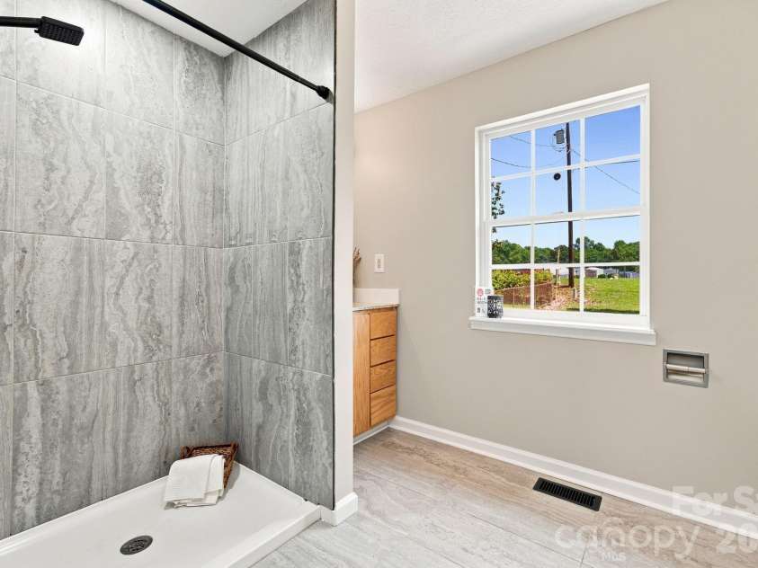 4709 Charlotte Highway, Lancaster, SC 29720.  MLS# CAR4397487, YatesRealty ID 44642. New stand in shower in primary bath