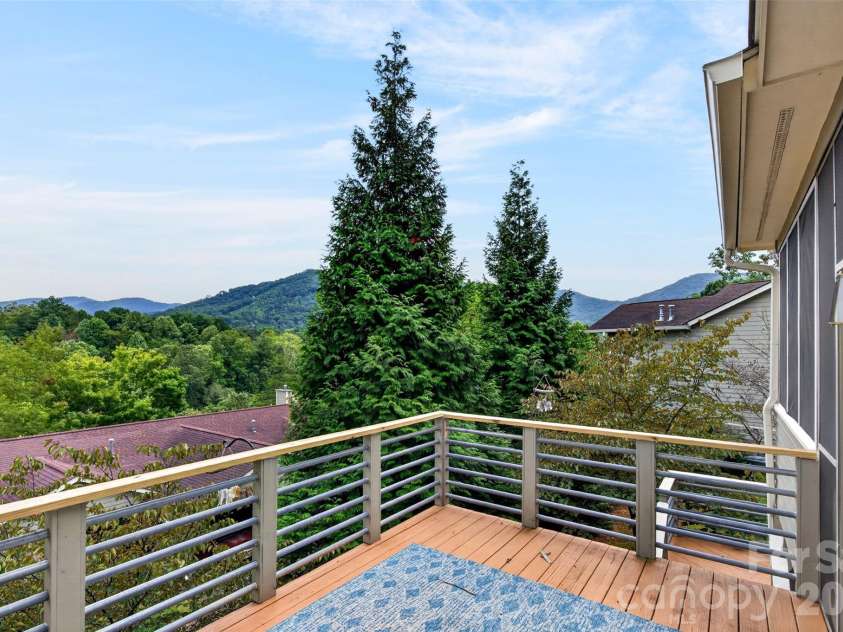 16 Spring Hollow Circle, Asheville, NC 28805.  MLS# CAR4412401, YatesRealty ID 44657. The open deck really brings in the views.