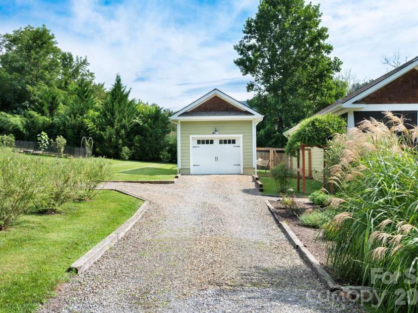 7 Addison Fisher Way, Asheville, NC 28805.  MLS# CAR4414192, YatesRealty ID 44664. Detached one car garage for yard tools