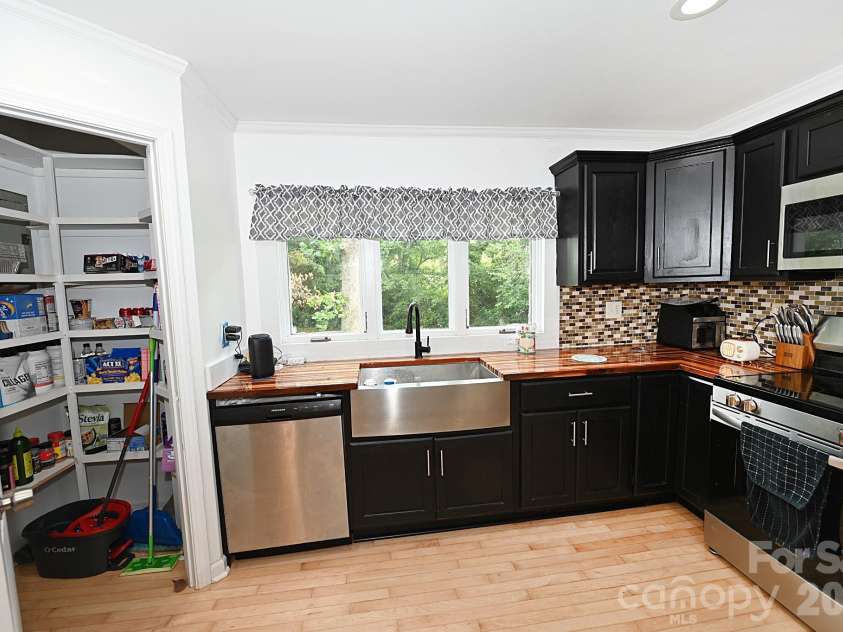 3392 Pearidge Road, Bostic, NC 28018.  MLS# CAR4414530, YatesRealty ID 44683. Kitchen with pantry