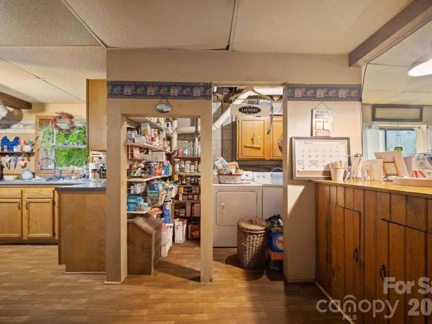 649 Monte Vista Road, Candler, NC 28715.  MLS# CAR4410166, YatesRealty ID 44684. Laundry / pantry off kitchen