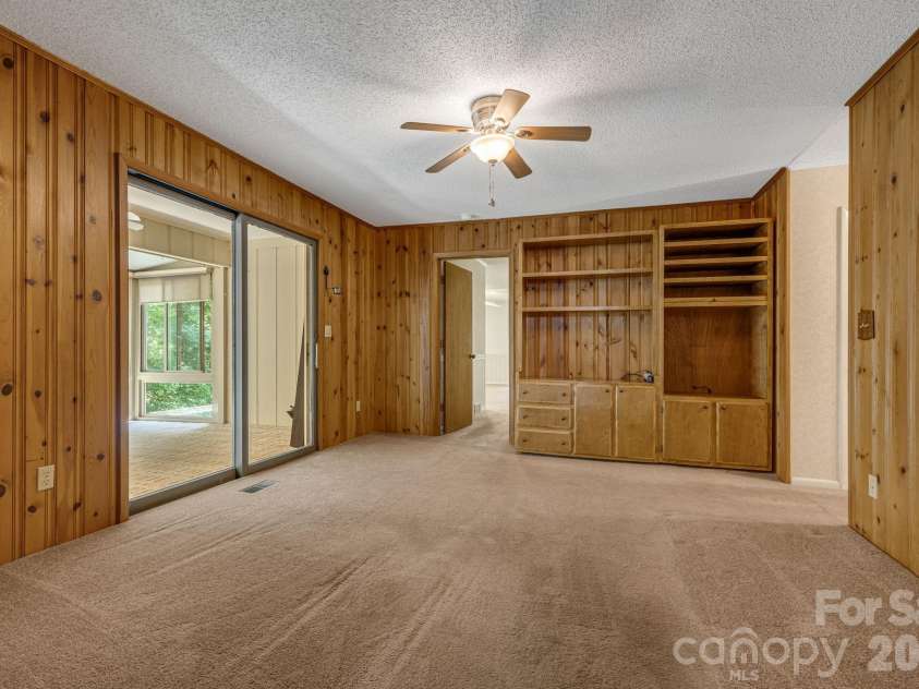 11 Ridgeway Drive, Weaverville, NC 28787.  MLS# CAR4414965, YatesRealty ID 44696. Den with built-in entertainment center