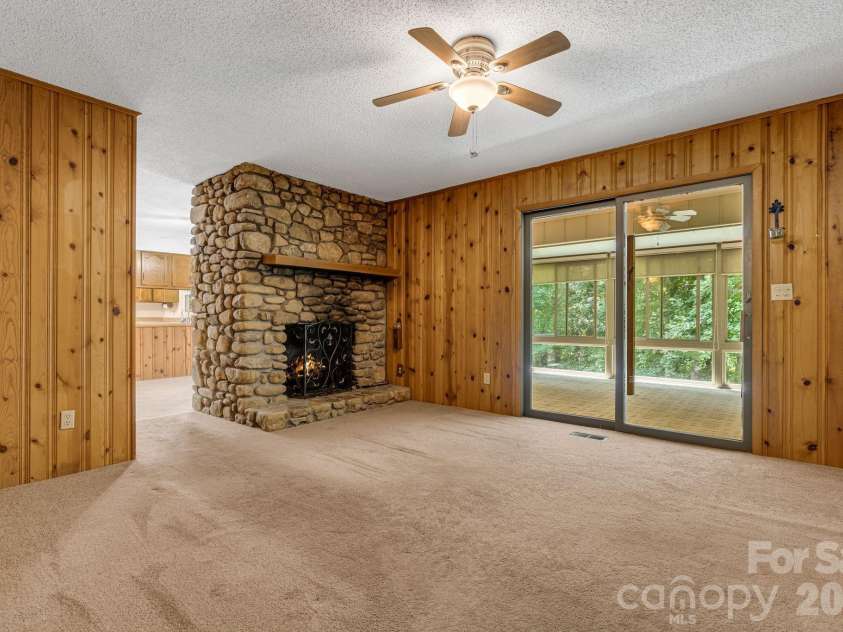11 Ridgeway Drive, Weaverville, NC 28787.  MLS# CAR4414965, YatesRealty ID 44696. Den with fireplace