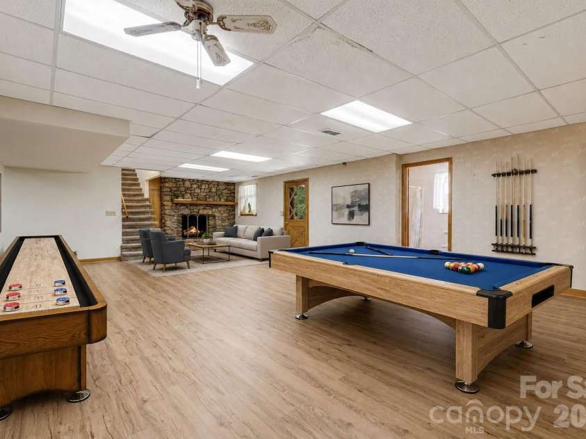 11 Ridgeway Drive, Weaverville, NC 28787.  MLS# CAR4414965, YatesRealty ID 44696. Family Room in Basement Virtually Staged