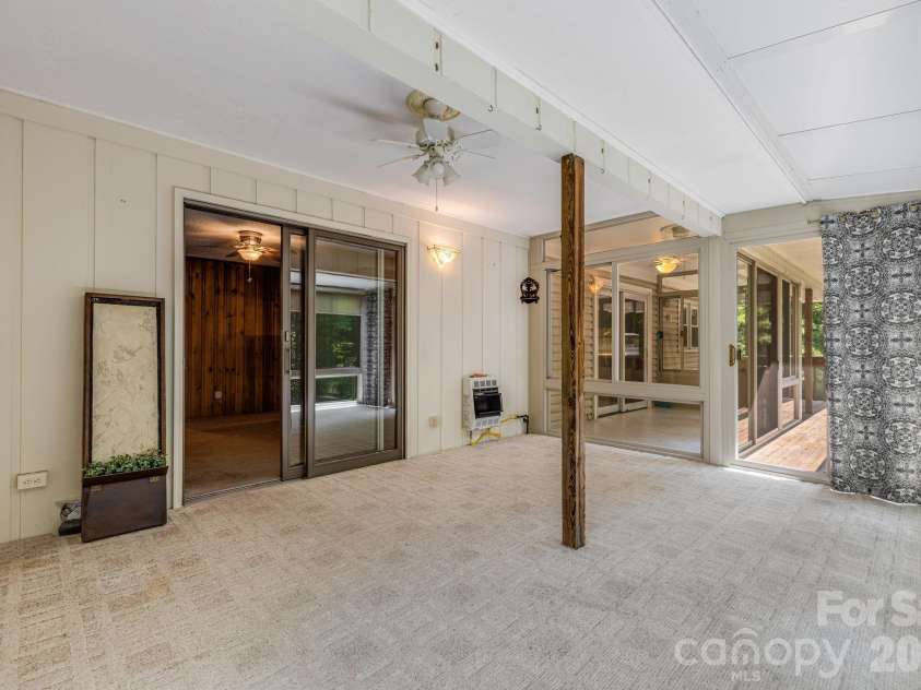 11 Ridgeway Drive, Weaverville, NC 28787.  MLS# CAR4414965, YatesRealty ID 44696. Four-Season Room with heat source