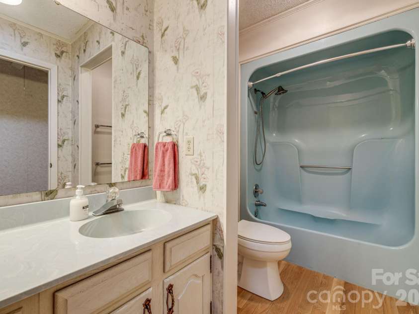 11 Ridgeway Drive, Weaverville, NC 28787.  MLS# CAR4414965, YatesRealty ID 44696. Hallway Bathroom