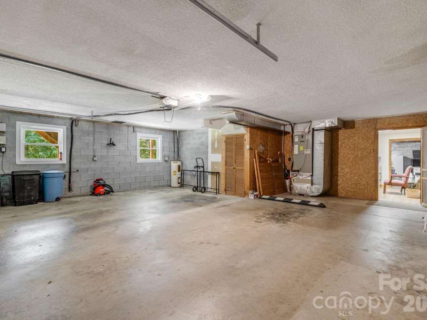 11 Ridgeway Drive, Weaverville, NC 28787.  MLS# CAR4414965, YatesRealty ID 44696. Two car garage in basement