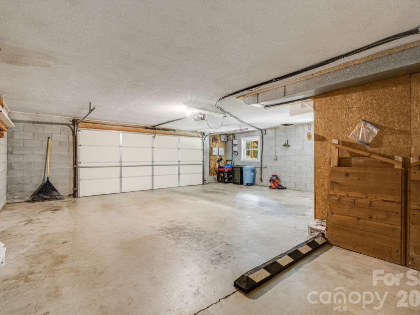 11 Ridgeway Drive, Weaverville, NC 28787.  MLS# CAR4414965, YatesRealty ID 44696. Two car garage in basement