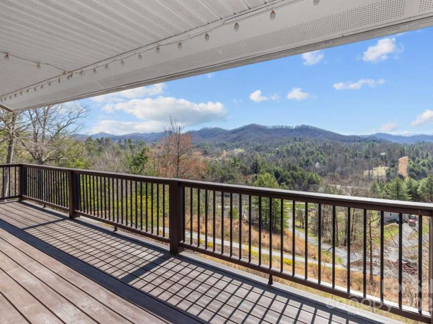 106 Clear View Drive, Mars Hill, NC 28754.  MLS# CAR4233910, YatesRealty ID 4471. Expansive deck, overlooking mountains