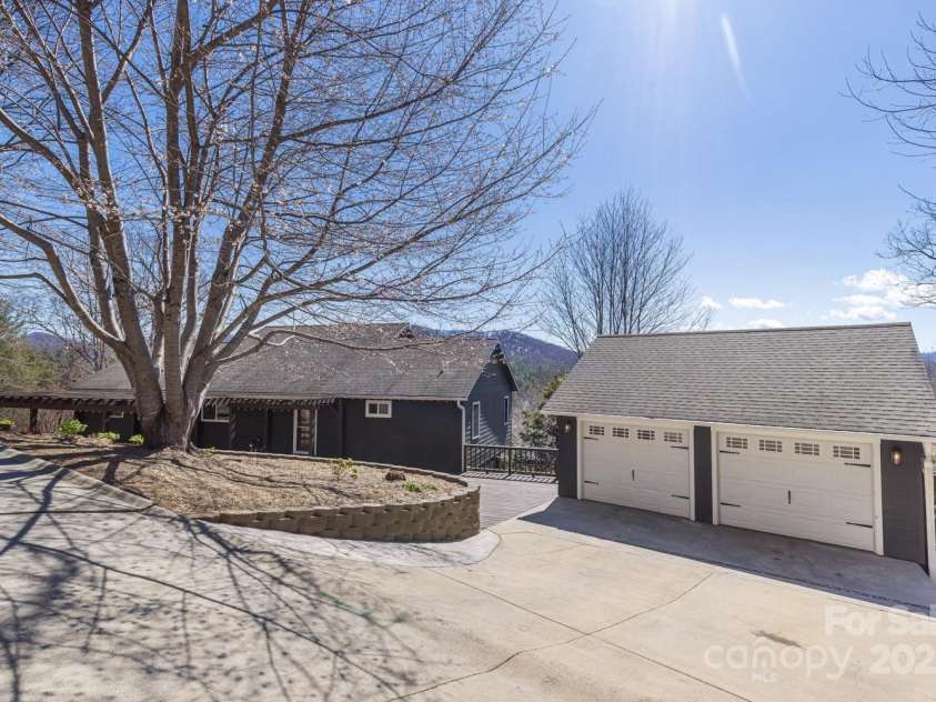 106 Clear View Drive, Mars Hill, NC 28754.  MLS# CAR4233910, YatesRealty ID 4471. Front of home with two car garage