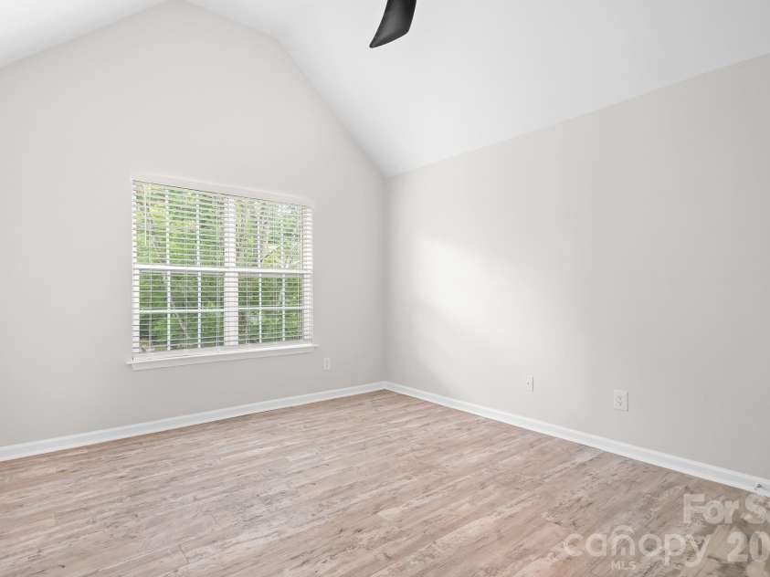 19300 Kanawha Drive, Cornelius, NC 28031.  MLS# CAR4414976, YatesRealty ID 44710. 2nd bedroom with vaulted ceilings