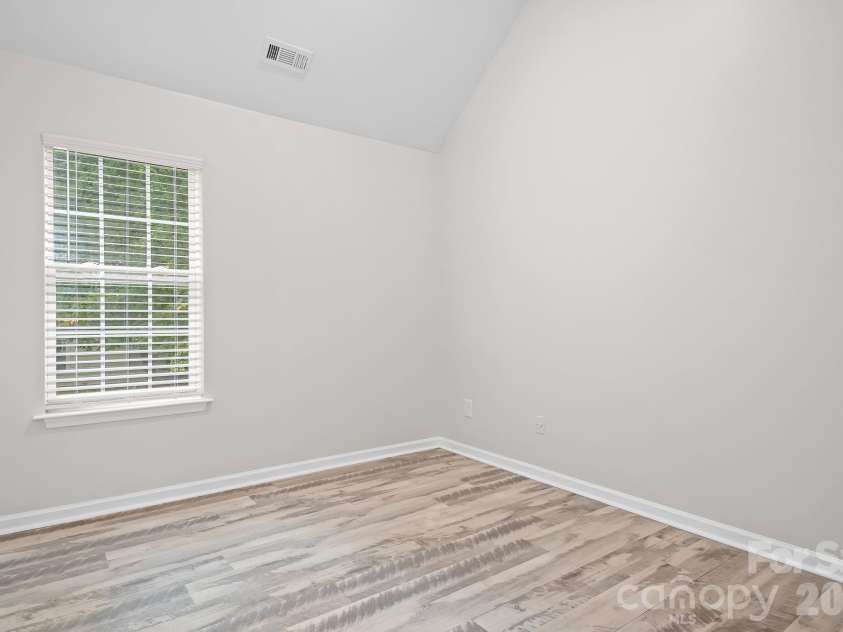 19300 Kanawha Drive, Cornelius, NC 28031.  MLS# CAR4414976, YatesRealty ID 44710. 3rd bedroom with vaulted ceilings