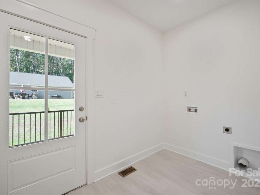 7589 Katherine Drive, Denver, NC 28037.  MLS# CAR4311633, YatesRealty ID 44729. Laundry/mud room from covered side porch entrance