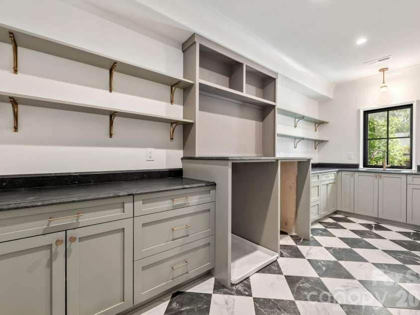 237 Canterbury Road, Charlotte, NC 28211.  MLS# CAR4412714, YatesRealty ID 44731. Upper floor laundry room