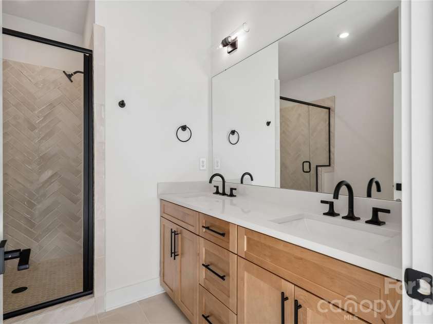 5013 Dutchess Drive, Charlotte, NC 28217.  MLS# CAR4407841, YatesRealty ID 44742. Owner's bath with dual vanities