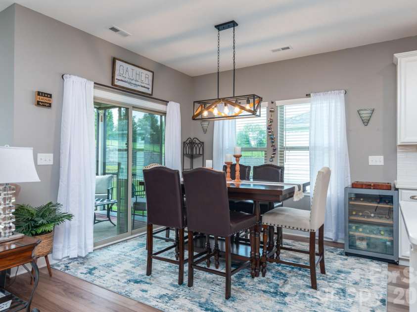 5134 Turtle Creek Drive, Denver, NC 28037.  MLS# CAR4415062, YatesRealty ID 44758. Genrous dining space leads to screened porch