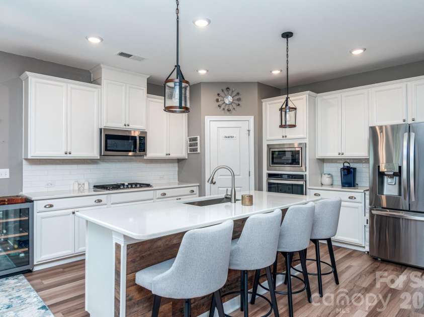 5134 Turtle Creek Drive, Denver, NC 28037.  MLS# CAR4415062, YatesRealty ID 44758. Island, cooktop, wall oven and microwave