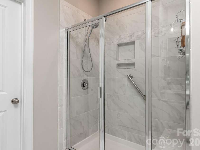 5134 Turtle Creek Drive, Denver, NC 28037.  MLS# CAR4415062, YatesRealty ID 44758. Large tiled primary shower