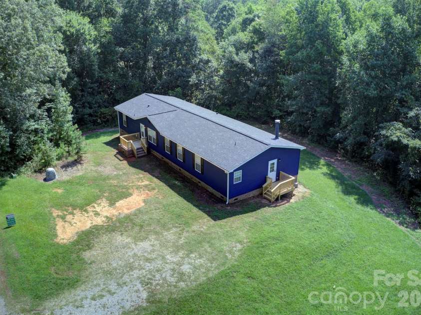262 Upper Stanley Road, Stanley, NC 28164.  MLS# CAR4413693, YatesRealty ID 44776. Aerial of front/side view